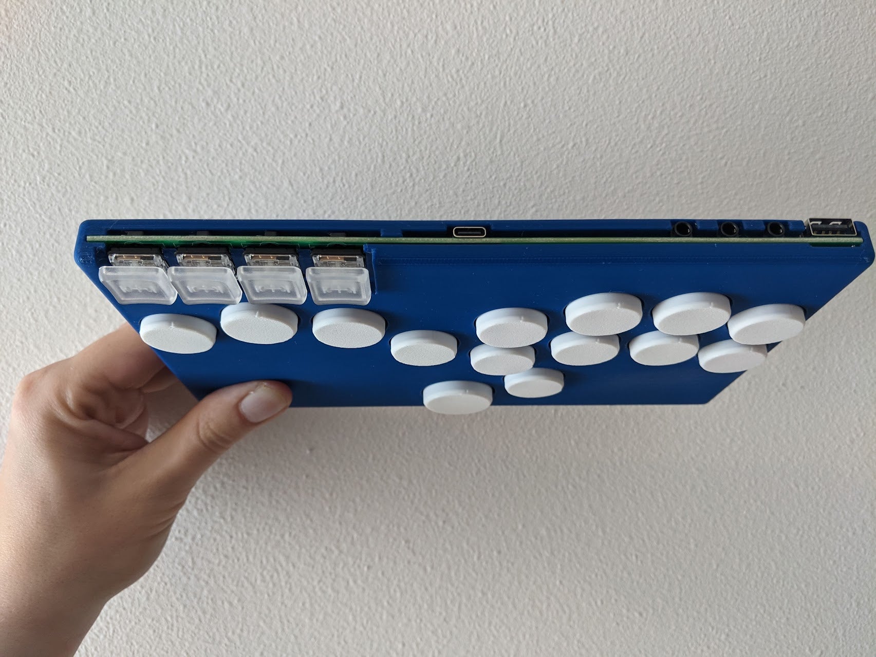 Top ports (left to right): USB-C, three accessibility ports, USB Passthrough