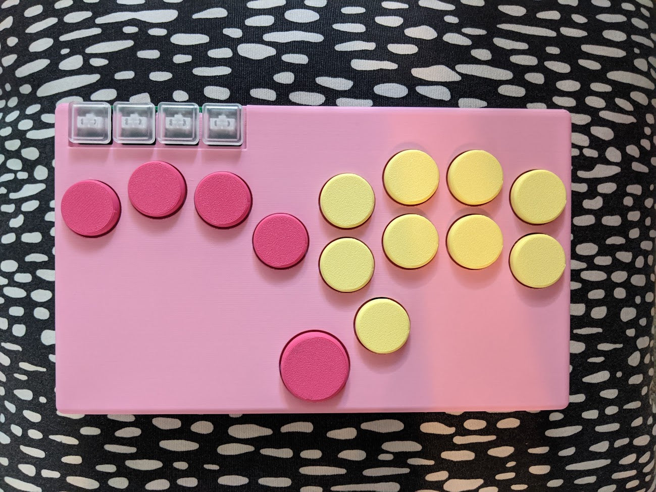 Pink case, magenta left side buttons, light yellow right side buttons, transparent menu buttons